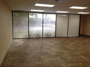 empty classroom with windows and blinds, carpet