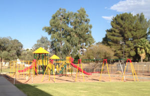 Yellow and Red slides and swings on playground