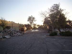 Torn up pavement outside a traditional charter school building