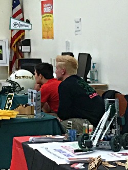 students at display table